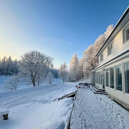Unique Wooden House On The Side Of The Canal